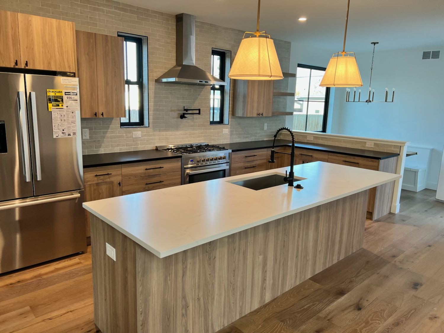 Full kitchen renovation with warm wood cabinetry for a homeowner in Westminster, CO.
