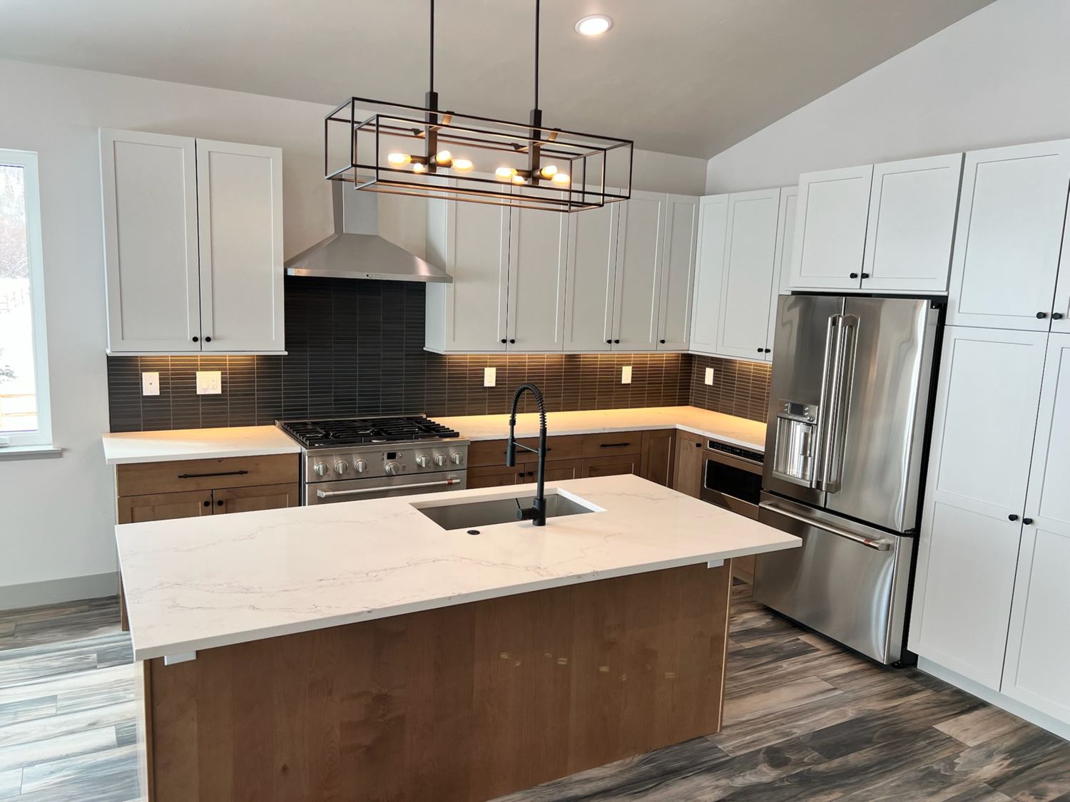 Kitchen remodel with waterfall quartz island
